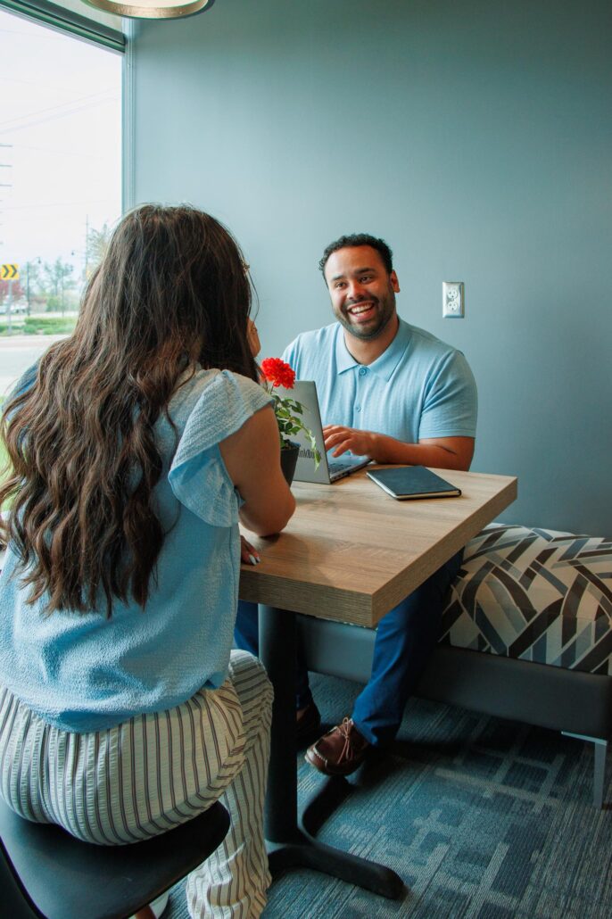 Man and woman conducting a business meeting at Terra Square which offers a professional, flexible workspace for entrepreneurs, remote workers, and small business owners.